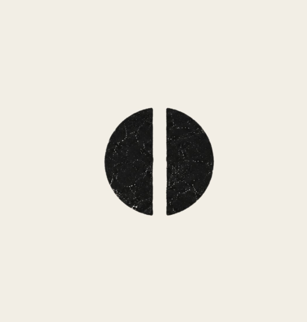 Split black circle with a vertical gap down the middle